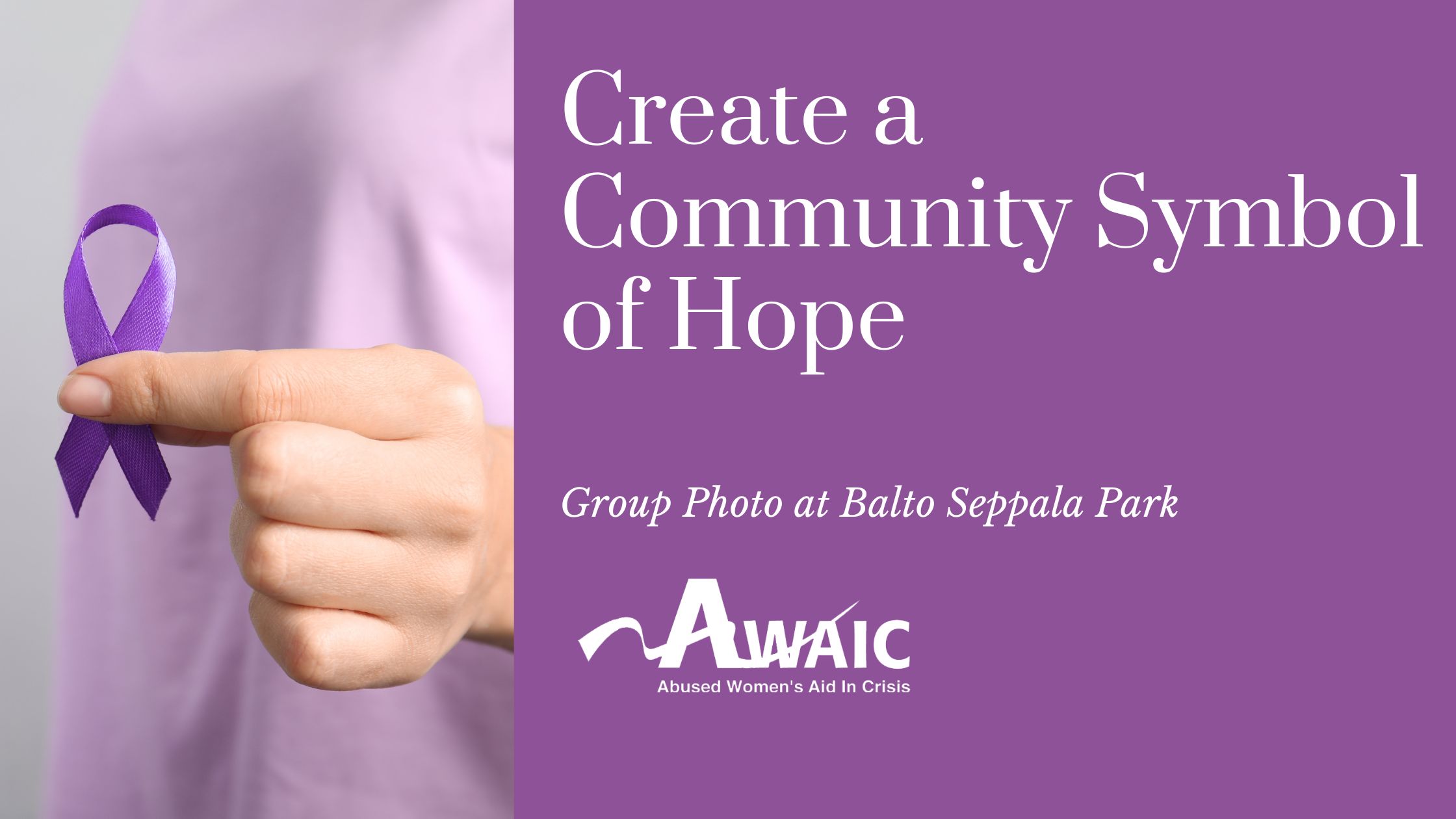 Hand holding a purple awareness ribbon.
